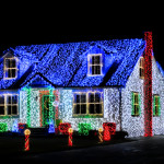 Christmas Lights Show Display on House at Night