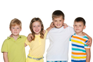 Portrait of a group of four smiling children