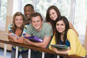 Group of college students leaning on banister