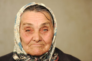 Closeup portrait of elderly serious woman, age between 60 and 70